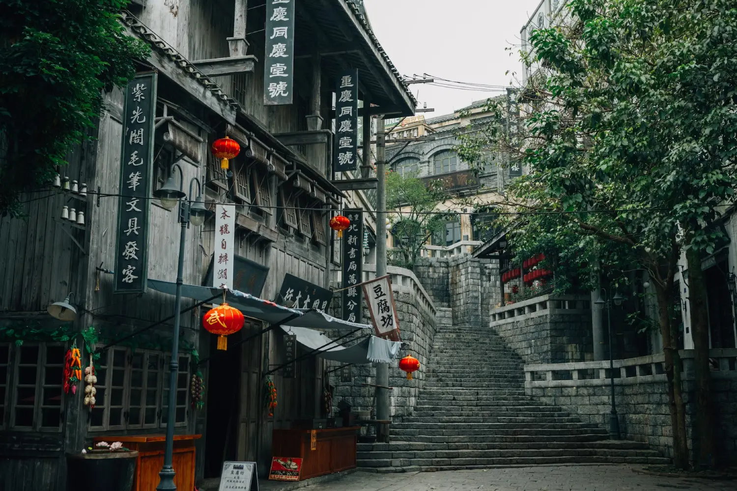 A street with stairs and buildings on the side.